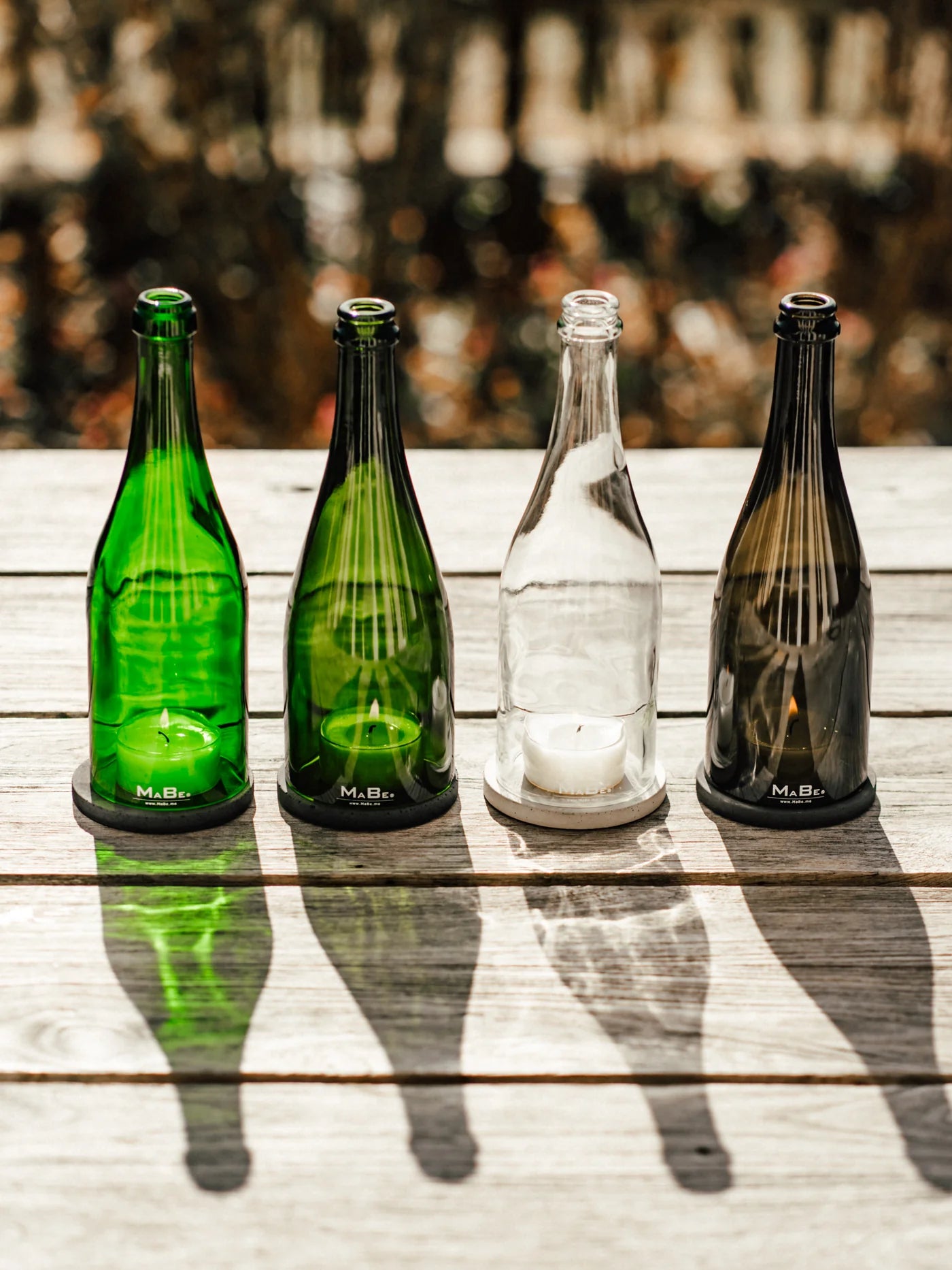 Sekt Windlicht mit Beton Untersetzer von MaBe - handgefertigtes Lichtobjekt aus der Prosecco Flasche